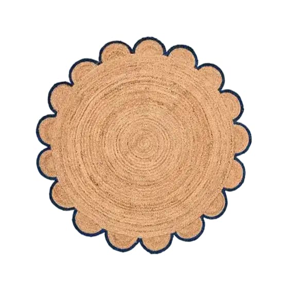 A scalloped round jute area rug with a distinct black trim, perfect for adding a natural touch to your living room decor. This elegant round rug showcases the intricate textures of natural jute, making it an ideal choice for area rugs for living room settings.