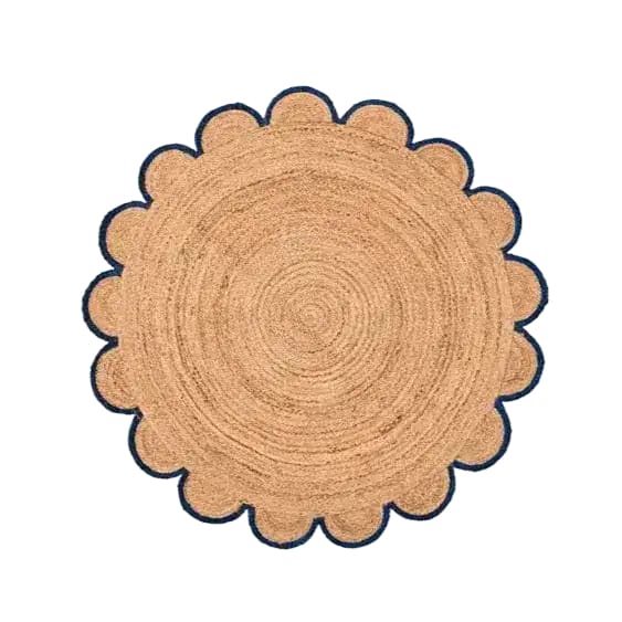 Stylish and natural, this round area rug features a scalloped edge with a striking black trim, crafted from jute. Perfect for adding a touch of elegance to any living room.