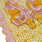 Vibrant and artistic hand-tufted area rug featuring a serpentine design in pink and yellow hues. Perfect for adding a touch of elegance to your bedroom or living room. This wool rug showcases intricate patterns and a scalloped edge, ideal for those seeking unique bedroom rugs or living room area rugs.