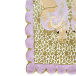 Close-up view of the Scalloped Serpentine Duo Harmony Hand Tufted Rug, showcasing its intricate design and soft texture. This wool area rug features a unique scalloped edge and abstract patterns, perfect for adding a touch of elegance to your bedroom or living room.