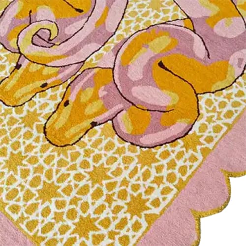 Vibrant hand-tufted area rug featuring an abstract serpentine design in pink and yellow hues, perfect for adding a pop of color to your bedroom or living room. This wool rug showcases intricate patterns and scalloped edges, ideal for those seeking unique living room area rugs or bedroom rugs.