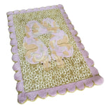 A vibrant hand-tufted area rug featuring a unique serpentine design with pastel colors. This wool rug is perfect for adding a touch of elegance to either a bedroom or living room. The scalloped edges and intricate pattern make it an eye-catching centerpiece for any space, ideal for those looking for stylish bedroom rugs or living room area rugs.