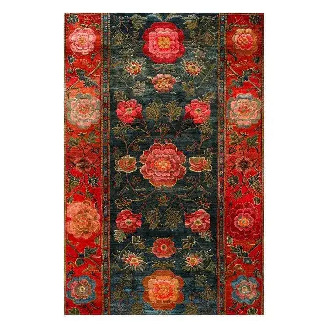 The Scarlet Blossom Heritage Hand Tufted Area Rug showcases a vibrant floral design, perfect for enhancing any dining room or living room. This wool rug features rich red, green, and pink hues, creating an inviting atmosphere as a dining room carpet or a floral rug centerpiece.