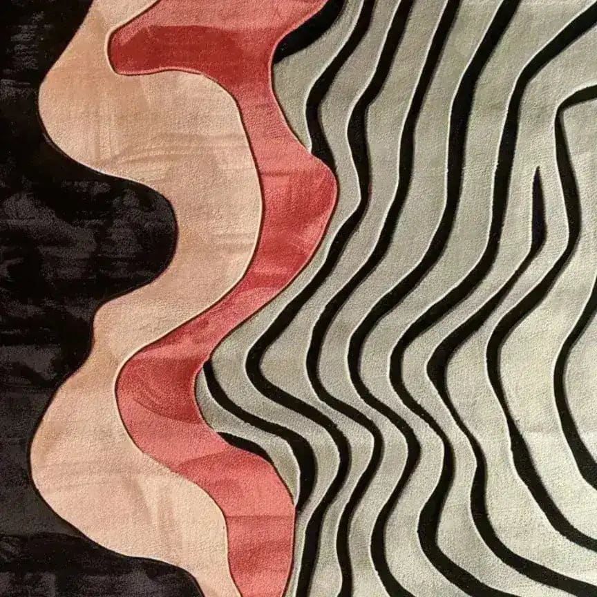A contemporary area rug featuring a bold, sculptural hand-tufted design with flowing patterns in red, pink, and black tones. Perfect for adding a modern touch to your bedroom or living room, this wool rug combines artistic flair with functionality, making it an ideal choice for bedroom area rugs.