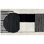 Top view of the Sea Murmur Hand Tufted Wool Rug, featuring a contemporary abstract design with bold black and white geometric patterns. Ideal as a runner rug for kitchens, hallways, or bathrooms, this wool rug adds a modern touch to any space.