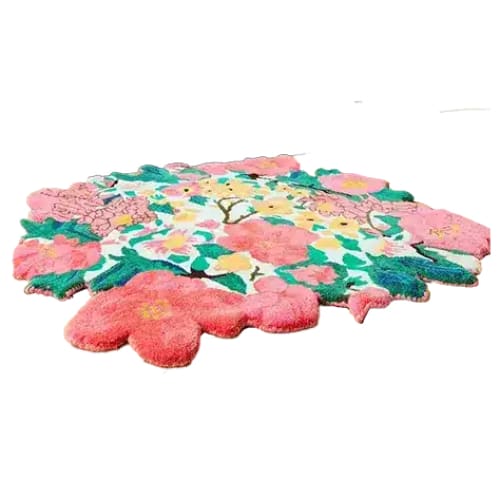 A vibrant Secret Garden Hand Tufted Round Rug featuring a beautiful floral design, perfect for adding a touch of elegance to your living room. This wool rug showcases an array of colorful blossoms, ideal for those seeking unique living room rugs 8x10. The round rug adds a soft, artistic flair to any space, making it a standout piece among rugs for living room decor.