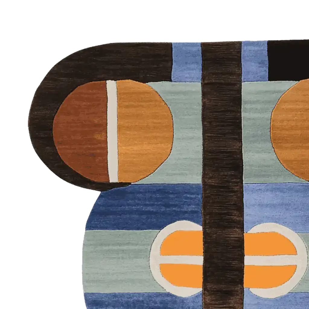Close-up view of a contemporary hand tufted wool area rug, showcasing its abstract geometric design with bold colors including blue, orange, and brown. Perfect for enhancing modern living room spaces, this 8x10 rug offers a stylish and artistic touch.