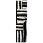 Top view of the Sentinel Pathway Hand Tufted Wool Rug featuring a striking black and white geometric pattern. This runner rug is perfect for adding a contemporary touch to your hallway or kitchen. Its durable wool construction makes it a stylish and practical choice for high-traffic areas like the kitchen, bathroom, or any hallway needing a modern upgrade.