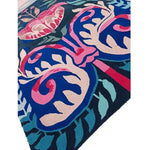 Vibrant Serenade of Mexico Hand Tufted Area Rug featuring bold floral patterns in pink, blue, and green, perfect for enhancing a dining room or bedroom with its artistic design. This wool rug adds a splash of color, making it an ideal choice for those seeking unique dining room carpets or rugs for a bedroom.