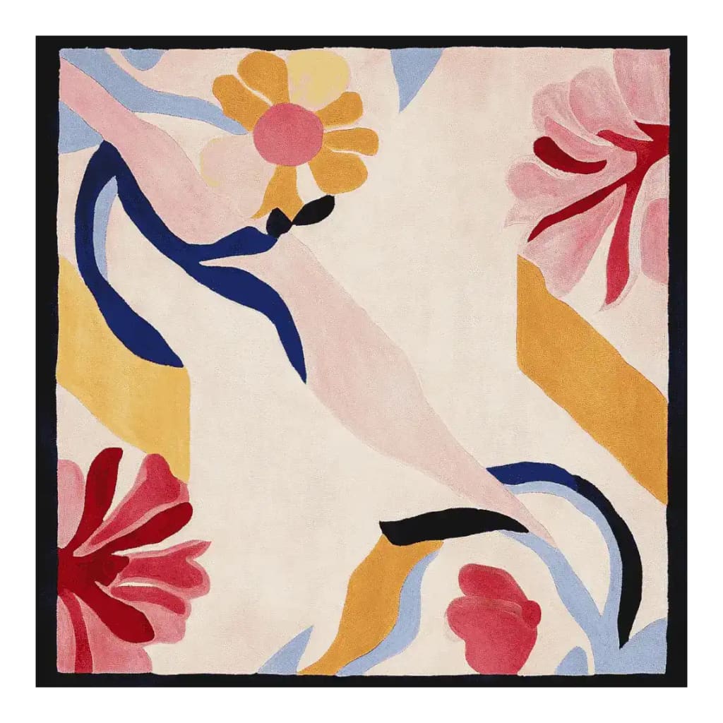 This vibrant area rug features an abstract floral design with bold colors like red, yellow, blue, and pink, perfect for a contemporary living room. The hand-tufted wool rug has a square shape, adding a modern touch to any large space.