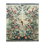 Serene Garden Tapestry Hand Knotted Area Rug featuring intricate floral designs with vibrant colors, perfect for enhancing living room decor. This large Persian-inspired floral rug showcases a detailed pattern with birds and blossoms, making it an ideal choice for those seeking elegant living room area rugs.