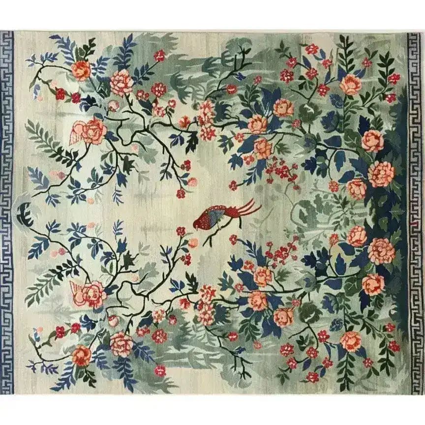 A beautifully crafted area rug featuring an intricate floral design with vibrant blossoms and lush foliage. Perfect for adding elegance to any living room, this large living room rug captures the essence of Persian rugs with its hand-knotted craftsmanship. The serene garden tapestry design creates a stunning centerpiece, ideal for those seeking a floral rug to complement their home decor.