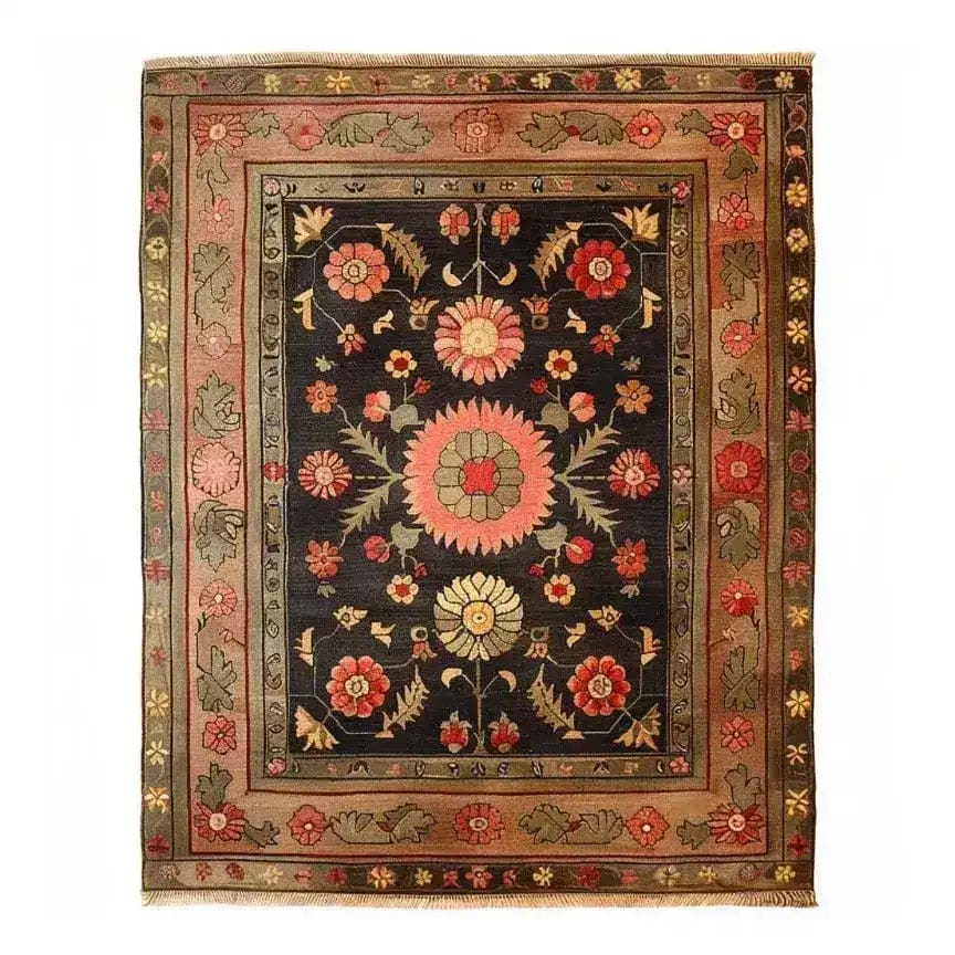 The Serene Sanctuary Hand Knotted Area Rug showcases a stunning floral design with vibrant colors on a dark backdrop. This vintage Persian-style rug is perfect for large living rooms, adding a touch of elegance and timeless charm. Ideal for those seeking rugs for living room spaces with a classic and sophisticated look.