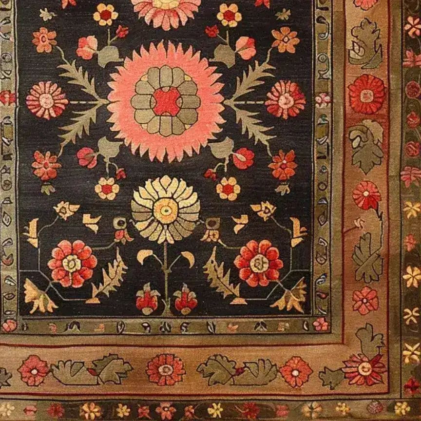 The Serene Sanctuary Hand Knotted Area Rug showcases an intricate floral design with vibrant pink and yellow blossoms against a dark backdrop, reminiscent of a vintage Persian rug. Perfect for large living room spaces, this floral rug adds a touch of elegance and timeless charm to any setting.