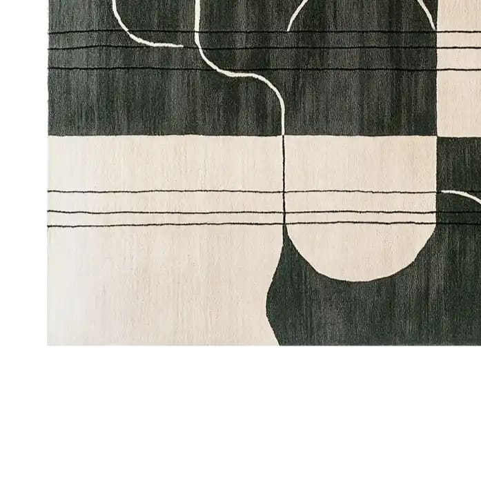 Close-up view of the Serene Soul Labyrinth Knotted Wool Rug showcasing its contemporary abstract design with black and white lines. This area rug is perfect for modern living rooms, available in an 8x10 size, crafted from high-quality wool.