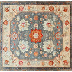 The Serenity Bloom Hand Knotted Area Rug features an elegant floral design with vibrant reds and soft blues, perfect for adding a vintage touch to large living room spaces. This Persian-inspired rug offers a timeless aesthetic, ideal for enhancing the style of your living room area.