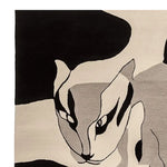 Close-up view of the Shadow Cat Mirage Hand Tufted Rug, featuring an abstract design of a cat in black, gray, and white tones. This contemporary wool area rug is perfect for adding a stylish touch to living room decor.