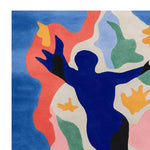 Vibrant and contemporary area rug featuring an abstract design with bold colors including blue, red, green, and orange. This hand-tufted wool square area rug adds a modern touch to any living room space.