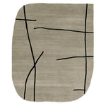 Contemporary area rug with abstract black lines on a soft beige wool surface, perfect for modern living rooms. This hand tufted rug blends style and comfort, making it an ideal wool rug for those seeking unique area rugs for living room spaces.