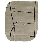 Contemporary area rug with abstract black lines on a soft beige wool surface, perfect for modern living rooms. This hand tufted rug blends style and comfort, making it an ideal wool rug for those seeking unique area rugs for living room spaces.