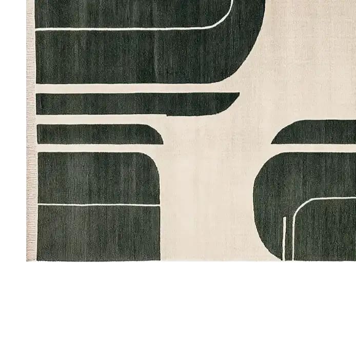 Top view of a contemporary area rug featuring a shadowed grid design in black and cream colors. This elegant wool rug is perfect for large living rooms, adding a touch of modern style and comfort.