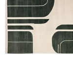 Top view of a contemporary area rug featuring a shadowed grid design in black and cream colors. This elegant wool rug is perfect for large living rooms, adding a touch of modern style and comfort.