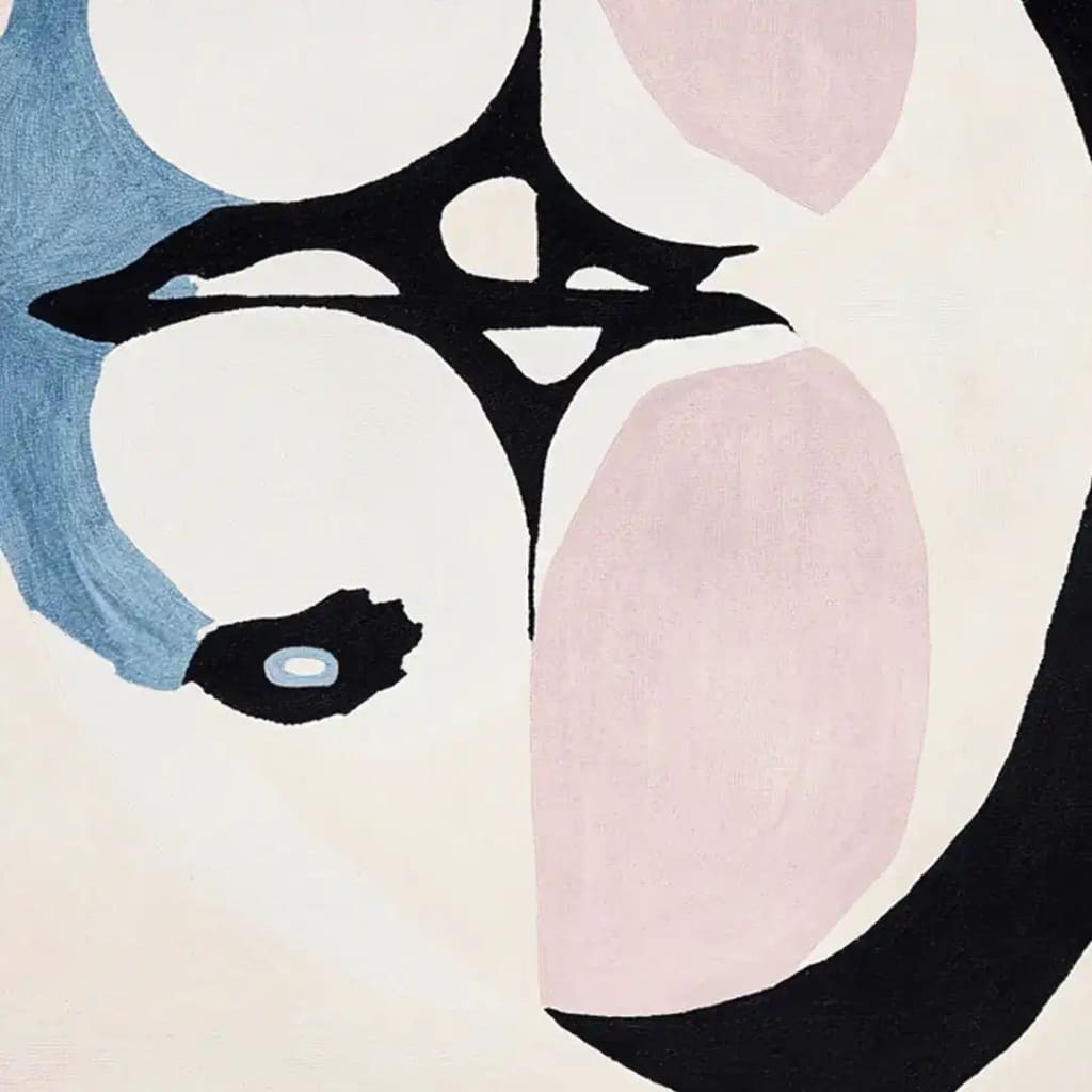 A contemporary area rug featuring an abstract design in shades of blue, pink, and black. This wool rug is perfect for adding a modern touch to living room spaces. Ideal as an 8x10 living room area rug.