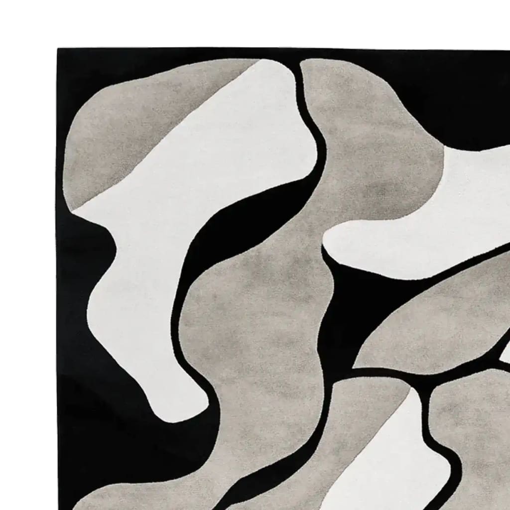 Top view of the Shadows in Motion Hand Tufted Area Rug, featuring an abstract design in shades of black, white, and gray. This contemporary wool rug is perfect for adding a modern touch to living room area rugs, offering both style and comfort.