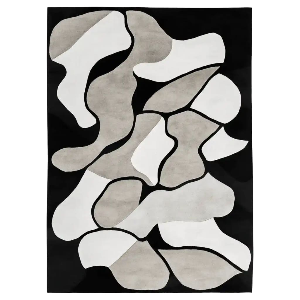 A contemporary hand tufted area rug featuring an abstract black, white, and gray pattern. This wool rug is perfect for adding a modern touch to living room area rugs. Its unique design makes it a standout piece among area rugs for living rooms.
