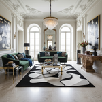 Luxurious living room with green sofas, a black and white abstract rug, and decorative elements.