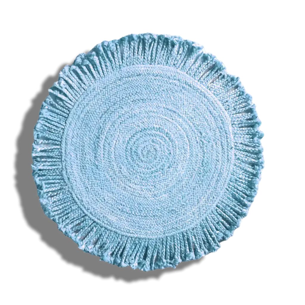 A beautifully crafted Shala Fringed Natural Round Jute Rug in a soothing blue color, perfect for adding a touch of elegance to your living room. This area rug features intricate weaving and a decorative fringe, ideal for living room rugs 8x10 or smaller spaces. Its round shape complements any living room area, making it a versatile choice for home decor.