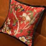 Shiny velvet throw pillow cover in scarlet with floral and bird patterns, perfect for adding a vibrant touch to your living space.
