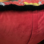 Shiny velvet scarlet throw pillow cover with a black fringed edge, perfect for adding a touch of elegance to your home decor.