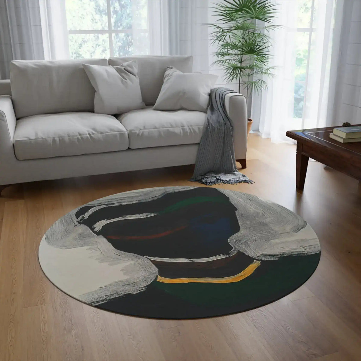 Silent Currents Round Rug placed on hardwood floor in bright living room with grey sofa and tropical plant
