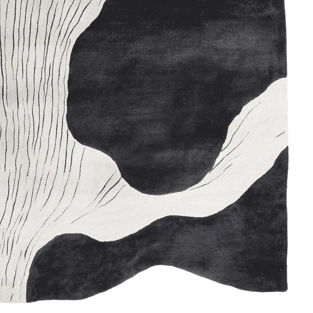 Top view of the Silent Ink Paths Hand Tufted Rug, a stylish area rug featuring a contemporary abstract design in black and white tones. This wool rug is perfect for adding a modern touch to living rooms, especially for spaces needing an 8x10 size rug.