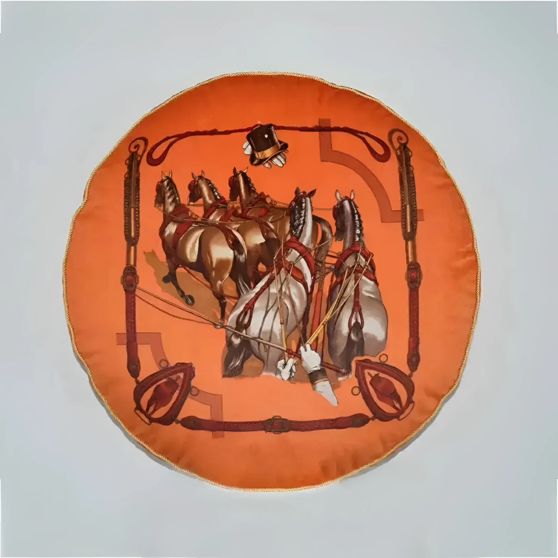 Round decorative throw pillow featuring a vibrant orange design with horses and harnesses, perfect for equestrian-themed decor.