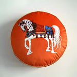Round decorative throw pillow featuring a beautifully illustrated horse design on an orange background, perfect for adding a whimsical touch to any home decor.