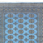 A beautifully intricate Sky Blue Anirudha Hand Knotted Area Rug featuring detailed geometric patterns in a soothing blue tone. Perfect for adding elegance to living room area rugs or as a standout piece in any rugs for living room collection.
