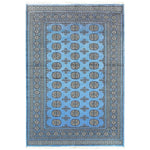 Sky Blue Anirudha hand-knotted area rug featuring intricate geometric patterns, perfect for elevating any living room space. This exquisite rug combines traditional craftsmanship with modern style, making it a standout choice among living room area rugs and rugs for living room decor.