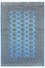 Sky Blue Anirudha hand-knotted area rug featuring intricate geometric patterns, perfect for elevating any living room space. This exquisite rug combines traditional craftsmanship with modern style, making it a standout choice among living room area rugs and rugs for living room decor.