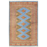 Sky Blue Java Kingdom Hand Knotted Area Rug featuring intricate geometric patterns in vibrant colors, ideal for enhancing the elegance of large living room spaces. Perfect choice for those seeking stylish rugs for living room decor.