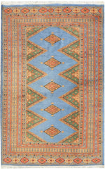 Sky Blue Java Kingdom Hand Knotted Area Rug featuring intricate geometric patterns in vibrant colors, ideal for enhancing the elegance of large living room spaces. Perfect choice for those seeking stylish rugs for living room decor.