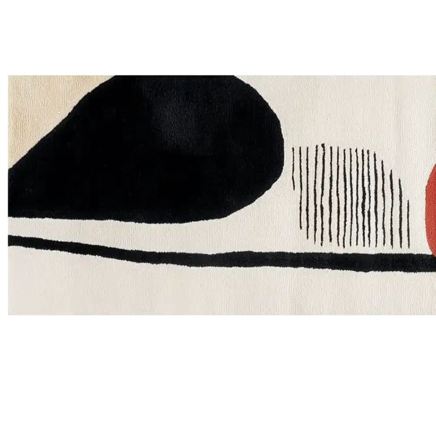 Close-up view of the Sky Song Hand Tufted Wool Rug, showcasing its contemporary design with abstract black and white shapes. Ideal as a hallway runner rug, kitchen rug, or bathroom runner rug, this wool rug adds a modern touch to any space.