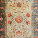 A beautifully crafted area rug with intricate floral designs, perfect for a large living room. This hand-knotted Persian rug features vibrant reds, yellows, and blues, creating an elegant and inviting atmosphere. Ideal for those seeking a floral rug in an 8x10 size.