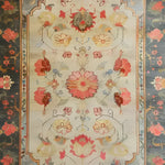 A beautifully crafted area rug with intricate floral designs, perfect for a large living room. This hand-knotted Persian rug features vibrant reds, yellows, and blues, creating an elegant and inviting atmosphere. Ideal for those seeking a floral rug in an 8x10 size.