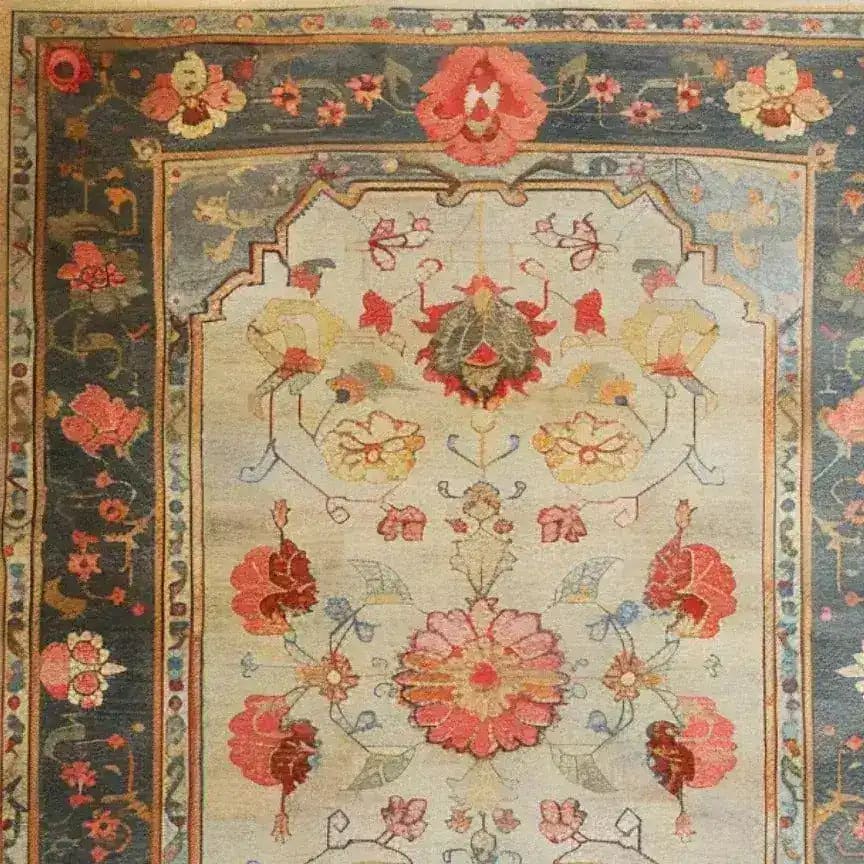 This image showcases the 'Sleek Floral Expression Hand Knotted Area Rug', perfect for large living rooms. The rug features an intricate floral design with vibrant hues of red, pink, and gold against a subtle background. Ideal as an 8x10 living room rug, this Persian-inspired floral rug adds elegance and charm to any space.