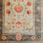 A beautifully detailed hand-knotted area rug showcasing a vibrant floral design. This large living room rug features intricate Persian-inspired patterns in rich, warm colors, perfect for adding elegance to any space. Ideal as a living room rug 8x10, its classic style enhances the home's decor.