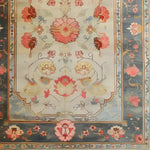 A beautifully detailed hand-knotted area rug showcasing a vibrant floral design. This large living room rug features intricate Persian-inspired patterns in rich, warm colors, perfect for adding elegance to any space. Ideal as a living room rug 8x10, its classic style enhances the home's decor.