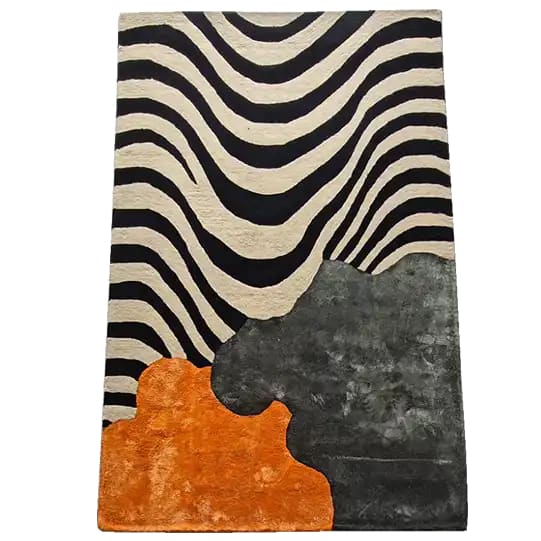 A contemporary area rug featuring sleek stripes and abstract patterns in black, white, orange, and grey. This tufted wool rug is perfect for adding a modern touch to a dining room or office space.