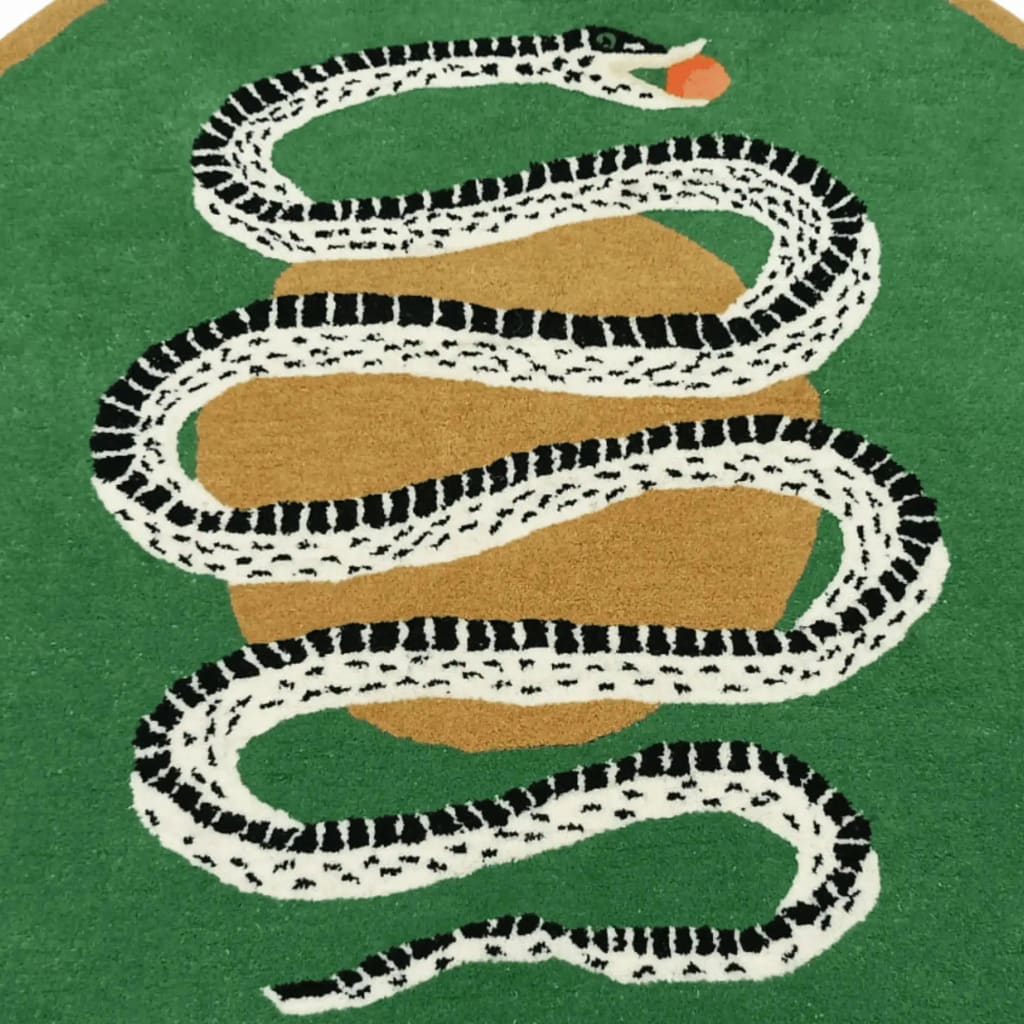 A stylish round wool area rug featuring a striking snake and apple design on a green background, perfect for enhancing a formal dining room setting. This large area rug adds a touch of elegance to dining room decor.
